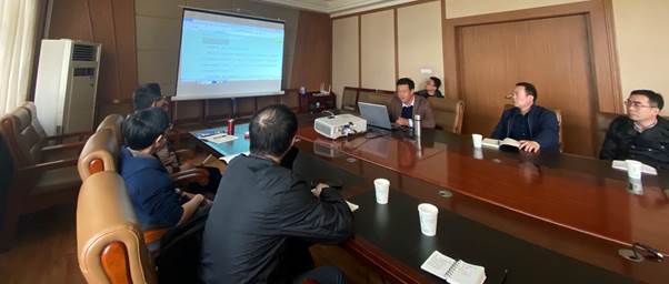 A group of people in a meetingDescription automatically generated with medium confidence